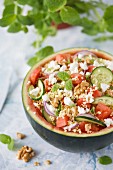 Watermelon salad with millet, cucumber and feta cheese