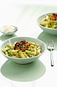 Penne pasta with pea pesto and bacon