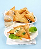Filo pastry triangles filled with feta cheese and broad beans