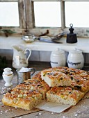 Focaccia topped with vegetables and coarse sea salt