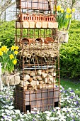 DIY bug hotel in flowerbed