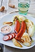 Sausages with grilled vegetables and sauce
