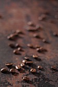 Espresso beans on a rusty surface