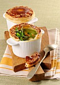 Vegetable soup topped with a puff pastry crust