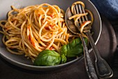 Plate of spaghettis with tomato sauce and basil