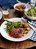 Beef steak with pepper salsa, green beans and fried potatoes
