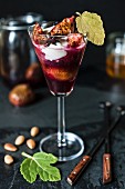 Poached spiced figs with crème fraîche in a stemmed glass