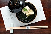 Kaiseki menu: scallop dumplings, bamboo, wakame algae and sancho pepper leaves