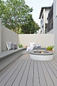 Masonry bench and hearth in modern courtyard