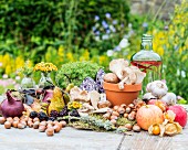 An autumnal arrangement of fruits, vegetables, mushrooms and nuts