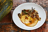 Roasted slices of Langer squash from Nepal with veal and porcini mushrooms