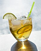 A cocktail made with rum, lime and ice cubes