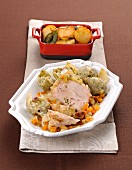 Braised pork with artichokes and roast potatoes