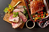 Crispy roast pork with balsamic sauce and colourful vegetables (seen from above)