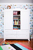 Wardrobe with bookcase module in child's bedroom