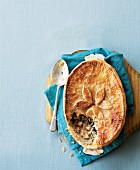 Chicken pie with puff pastry lid