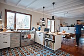 Man walking into open-plan kitchen