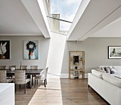 Light shining through skylight into open-plan interior