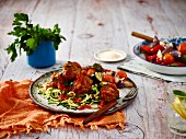 Meatballs in tomato sauce with courgette pasta