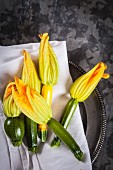 Courgette flowers on a cloth