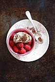 Fresh raspberries with cream and grated chocolate