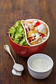 Tortillas with chicken, lettuce and a spicy yoghurt sauce