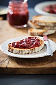 Strawberry jam on a slice of bread