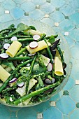 Pasta salad with radishes, green asparagus and feta cheese