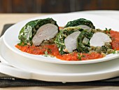 Chicken breast wrapped in chard on tomato sugo