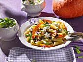 Pasta with pumpkin, feta cheese and sunflower seeds