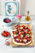 Pizza with caramelized red onions, goat's cheese and strawberries