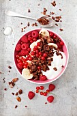 Chocolate muesli with oats, flaked almonds, yoghurt, bananas and berries