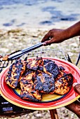 Barbecued chicken on a beach