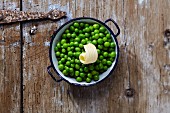 Peas with butter in a pot