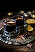 Mulled wine for Christmas with spices and oranges