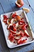 Oven-roasted peaches with ham, redcurrants and rosemary