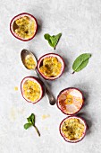 Passionfruit halves and mint leaves