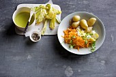 Courgette tempura with wasabi mayonnaise, and new potatoes with raw carrots