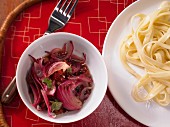 Red onion and bacon sauce with tagliatelle