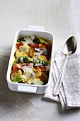 Mediterranean vegetable bake with polenta, aubergines, tomatoes and peppers