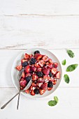 Berry salad with mint, basil and feta cheese