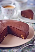 Chocolate mousse cake being cut