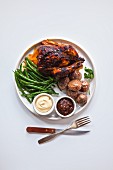 Grilled chicken, roasted potatoes, green beans, barbecue source and mayonnaise