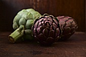 Artichokes on a wooden surface