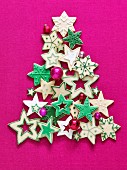 Colourful Christmas star biscuits in the shape of a Christmas tree