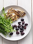 Grilled cheese, black olives and rocket