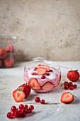 Strawberry-flavoured chia pudding with fresh strawberries and redcurrants