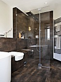 A purist and elegant design bathroom with brown tiles and a shower area with glass panels and a shower panel