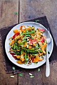 Carrot tagliatelle with tomatoes and rocket