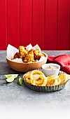 Fried onion rings with blue cheese sauce and Crunchy buttermilk drumettes